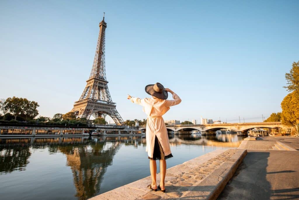 A backview of a girl looking at the Eiffel tower