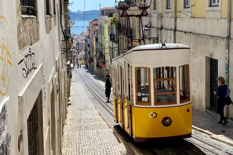 a downhill street of Lisbon Portugal- and a Bica Funicular 