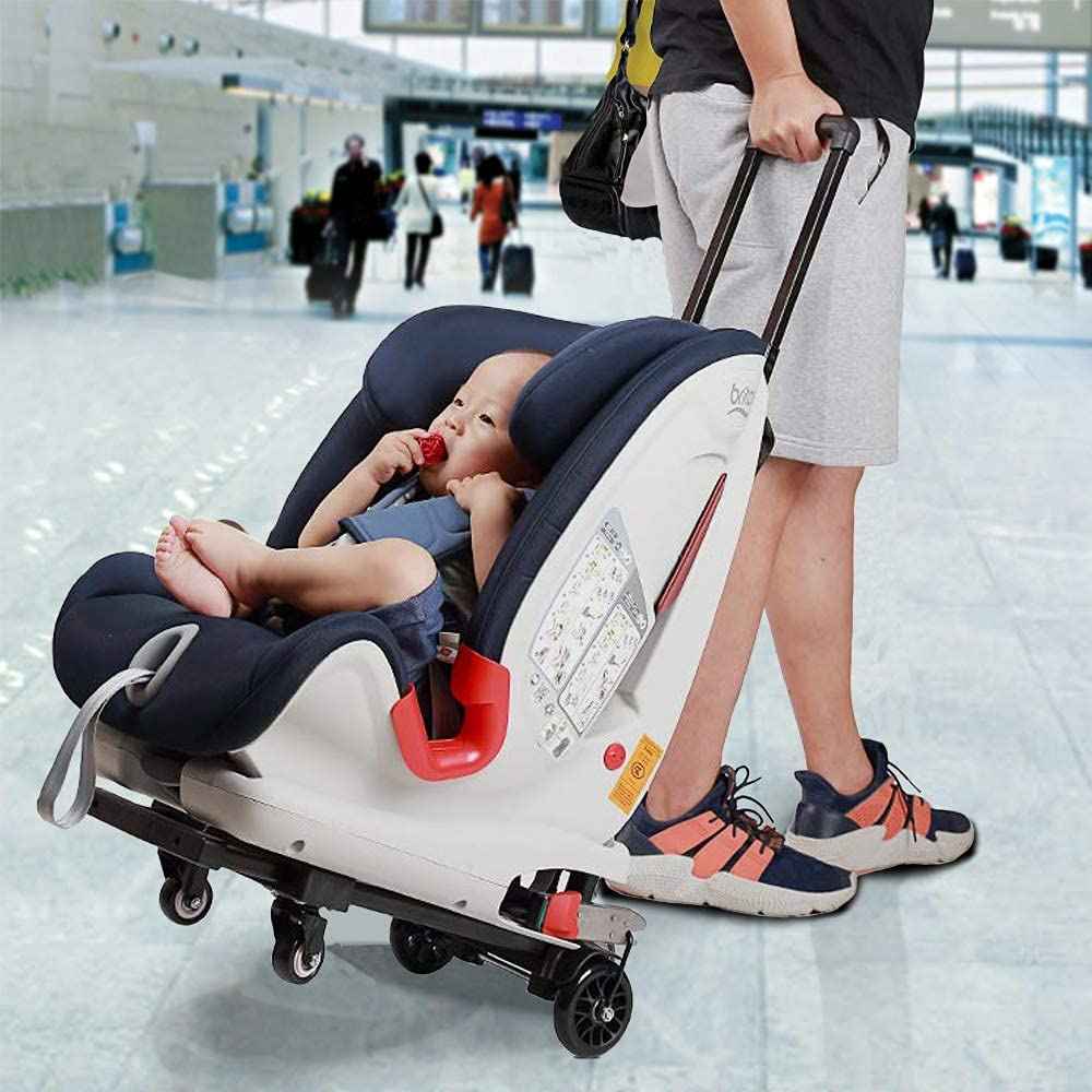 a trolly car seat with a baby sitting in it and a man pulling a car seat trolly