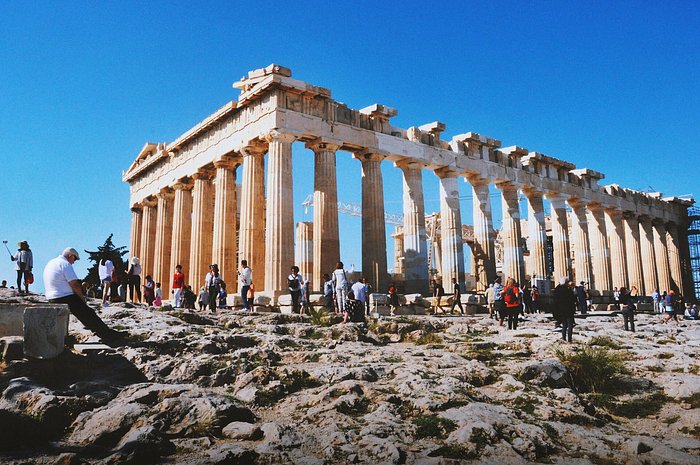 people taking pictures with Parthenon - athens city center in Greece