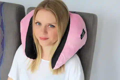 a aldy using ComfyCommuter Travel Pillow