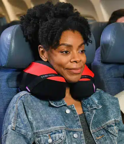 a lady wearing Cabeau Evolution Memory Foam Travel Pillow