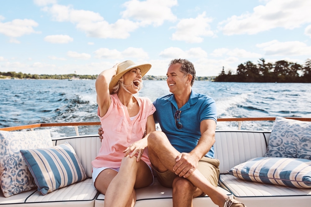 Laughing Happy Couple And On A Boat For Retirement Travel