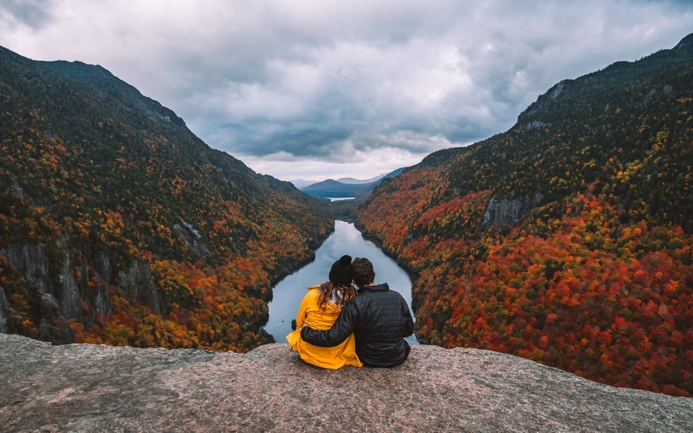 Hiking Adventure Couple Hold Each Other On Top Of Mountain