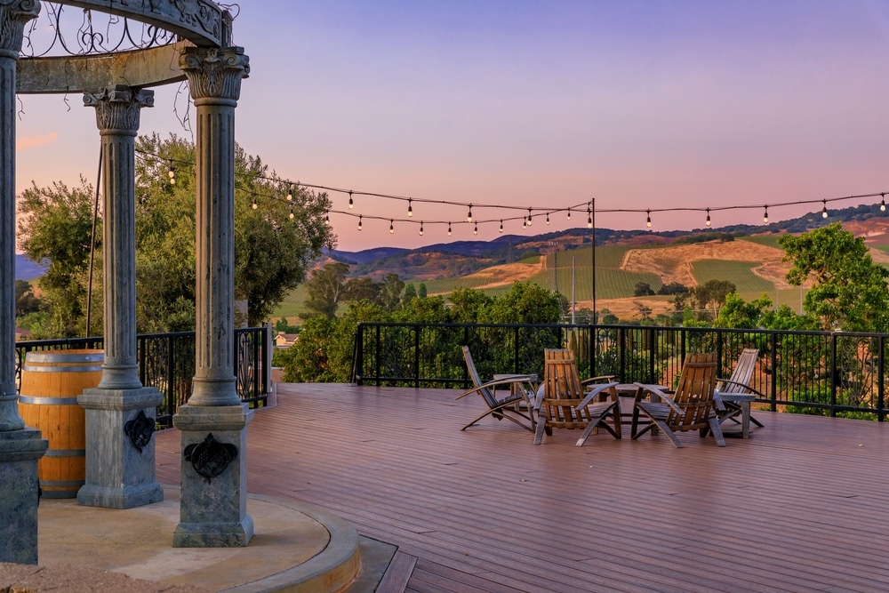 Outdoor Al Fresco Chairs And Table On A Wooden Deck