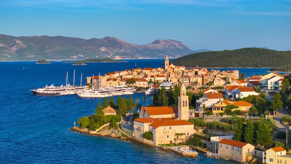 Aerial: Golden Summer Sun Illuminates The Quaint Old Town Of korcula